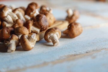 .Fresh shiitake mushrooms on the wooden kitchen table