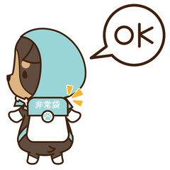 防災頭巾を被って非常袋を持った準備の良い犬のコーギー