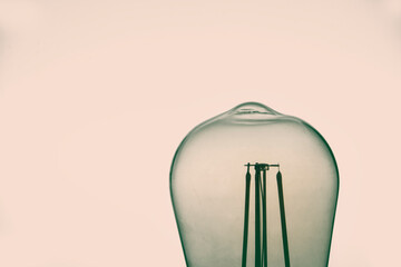 Peach and pistachio green vintage light bulb isolated on white backgrounds