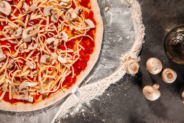 Top view on semi finished pizza with cheese and tomato sauce