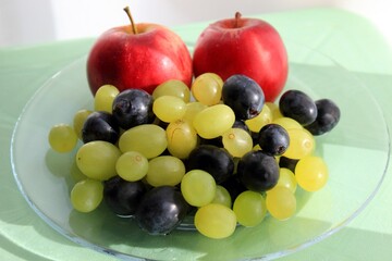 Fresh fruit on a glass platter on the table