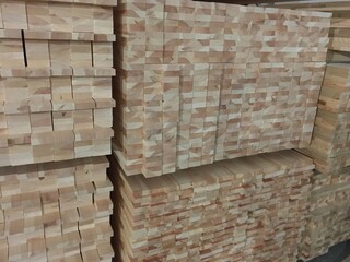 Warehouse for wooden materials. Particleboard and fiberboard close-up. Preparation of elements for creating products