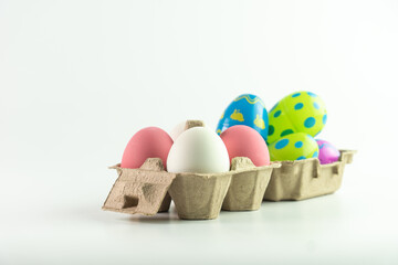 White and pink colors of eggs on Easter. Isolated white background.