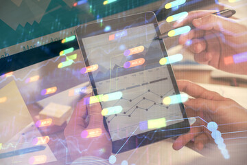 Multi exposure of man's hands holding and using a digital device and data theme drawing. Innovation...