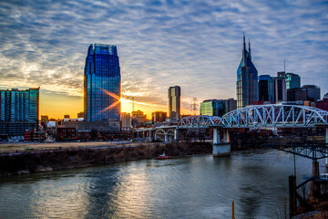 Fototapeta na wymiar Nashville skyline along the Cumberland river from the Korean Veterans Blvd bridge