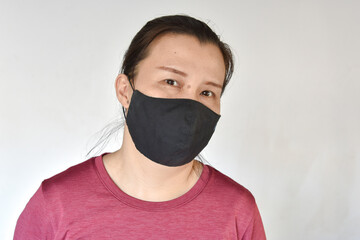 Asian woman wear a black handmade mask