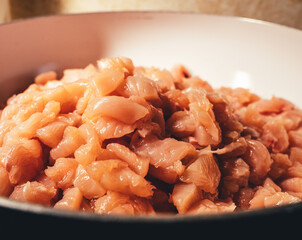 
Raw sliced ​​chicken pieces. To cook. Preparing for dinner. Cooking. A restaurant. Cafe. Workflow of cooking food