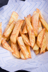 Crispy homemade fries on a white napkin