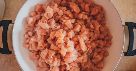 
Raw sliced ​​chicken pieces. To cook. Preparing for dinner. Cooking. A restaurant. Cafe. Workflow of cooking food