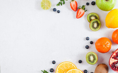 Flatlay assorted fresh and ripe fruits and berries. The concept of healthy eating. Copy space.