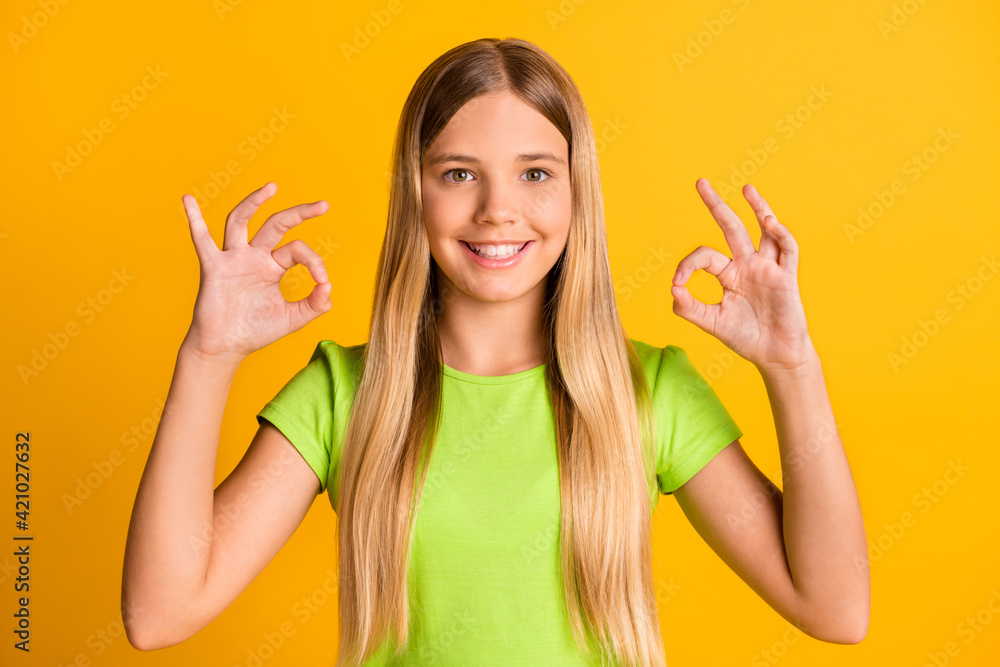 Canvas Prints Photo of young cheerful girl happy positive smile show okey sign done perfect alright feedback isolated over yellow color background