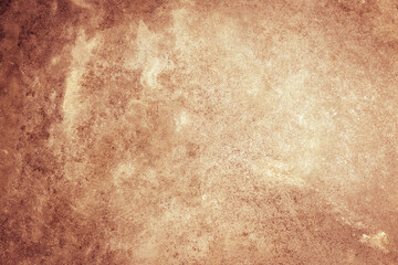 textured rust stucco background with scratches, scuffs and stains. grungy backdrop of ginger color...