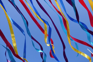 Bright multi-colored ribbons against the sky.