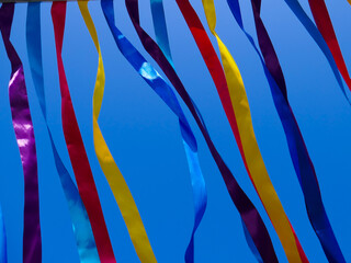 Bright multi-colored ribbons against the sky.