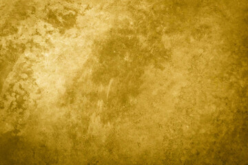 textured golden stucco background with scratches, scuffs and stains. plaster backdrop of yellow color for copy space
