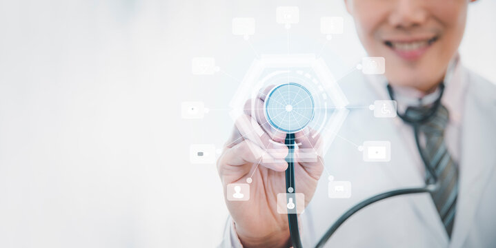 Medical young doctor and stethoscope looking at icons and touching medical network connection with modern virtual touch screen interface concept of medical care and stethoscope Medical technology 2021