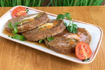 Roll of pork, eggs and vegetables