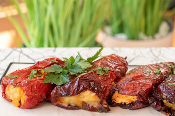 Fried, stuffed peppers with vegetables and rice