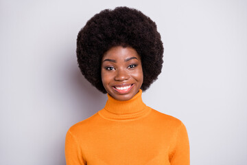 Photo of adorable curly hairstyle dark skin lady smile look camera wear roll neck outfit isolated on grey color background