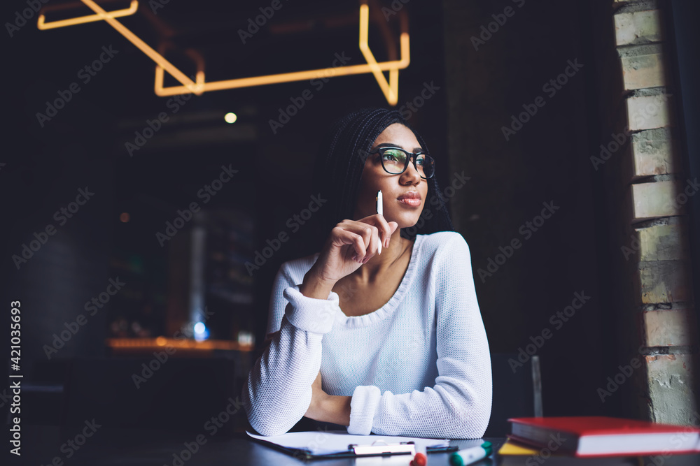 Wall mural Thoughtful African American woman with clipboard