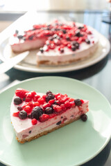 Greek yogurt berry birthday cake and champagne for kids on a dark caffe table