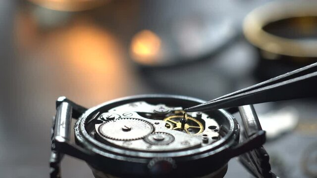 Mechanical watch repair process. Watchmaker