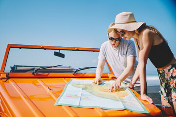 Young couple looking at map