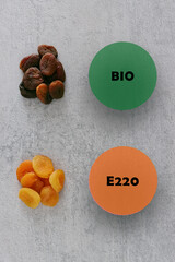 Dried apricot comparison. Apricot with preservatives (E220 Sulfur dioxide) and organic fruit...