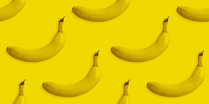 Yellow banana background pattern. Seamless pattern texture of many same fruits.