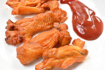 roasted barbecue chicken rib with honey sauce dipping ketchup on plate eat couple fresh cos vegetable salad