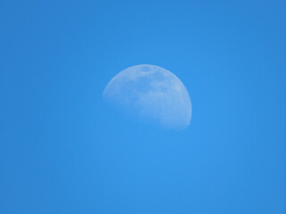 moon in the sky. The moon against the blue sky