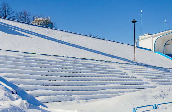 A Stadium With Bleachers In Winter Under The Snow.