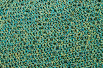 crochet thread blue green and yellow texture background closeup