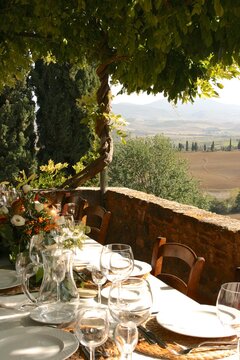 Table Set For Al Fresco Dinner On The Terrace. Tuscany, Italy 