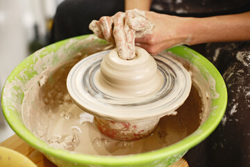 Adult mixed couple at artwork in pottery