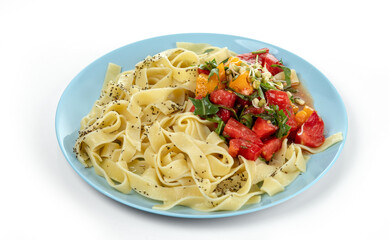 Plate with boiled noodles made from wheat flour with a salad of tomato, greens and sprouted mung beans. Isolated on a white background