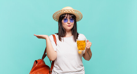 young traveler woman feeling puzzled and confused, doubting, weighting or choosing different...