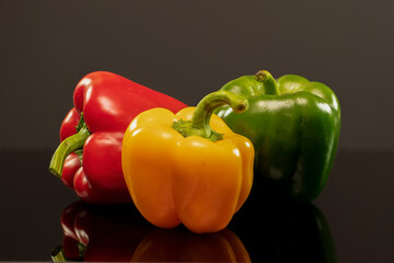 Healthy, colourful Bell Peppers on a black background