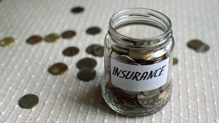 3D illustration - Coins filling in jar labeled for insurance
