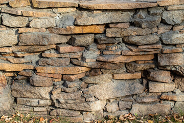 Granite stone wall background texture.
