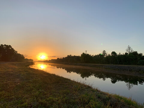 Sunrise over a drainage canal in Weston Florida.