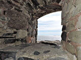 Fototapeta na wymiar Window in old fortess with sea view