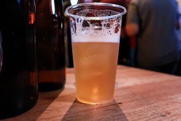 Draft beer.  Enjoying Evening Drinks at the pub party in a nightclub .