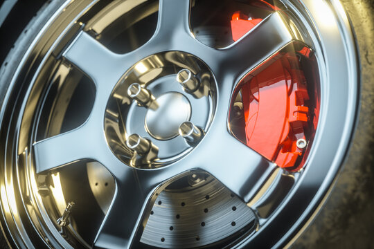 Red  brakes system and car wheel closeup. 3d render