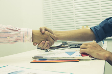 Business handshake and business people.Vintage tone ,soft focus.