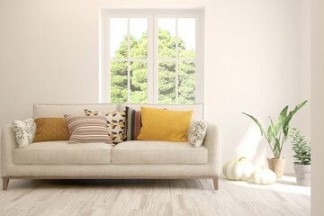 White living room with sofa and summer landscape in window. Scandinavian interior design. 3D illustration