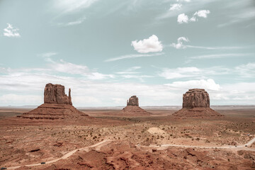 Print poster of Monument Valley. Warm boho photo of desert panoramic view. Navajo tribal park, on the Border between Arizona and Utah, United States. Amazing and colorful rocks. Western concept. 
