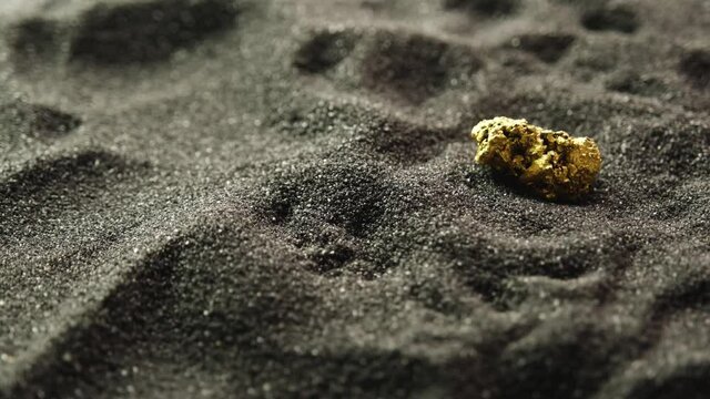 Pure gold from the mine that was unearthed was placed on the black sand