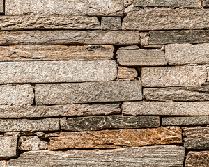 brown stone wall closeup, textured pattern, natural background