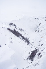 Fototapeta premium Snowy winter mountains in Georgia. Caucasus Mountains